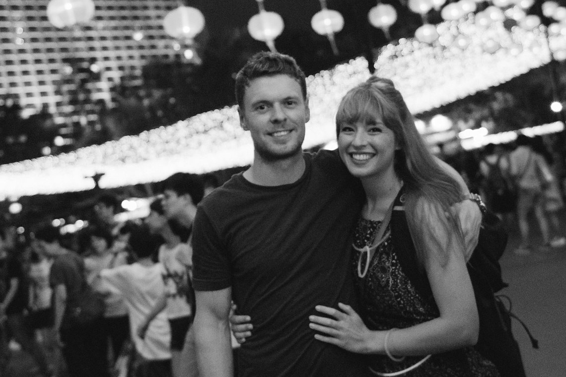 Ariane and Chris under festival lanterns at night